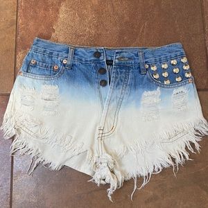 Acid wash denim shorts with studs